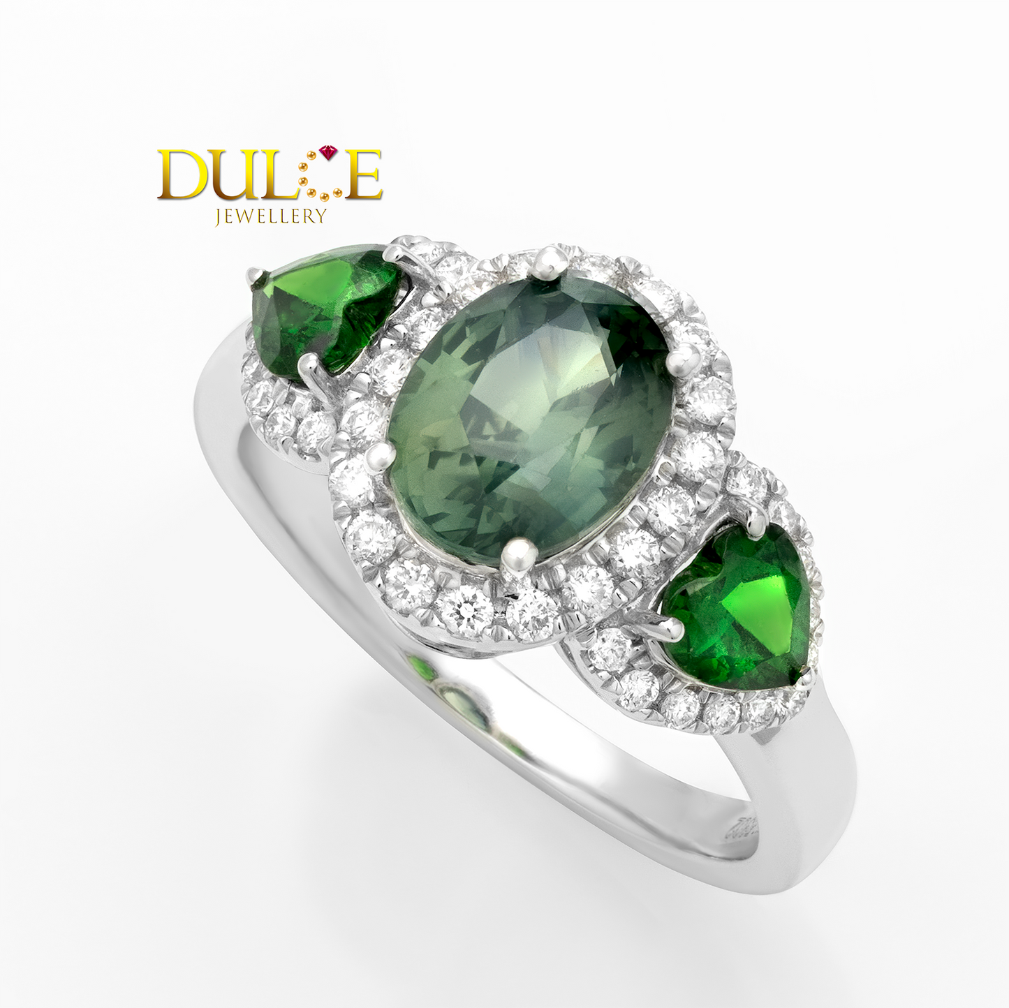 Jewelry ring with green gemstones and diamonds on a white background, featuring the Dulce Jewellery logo.