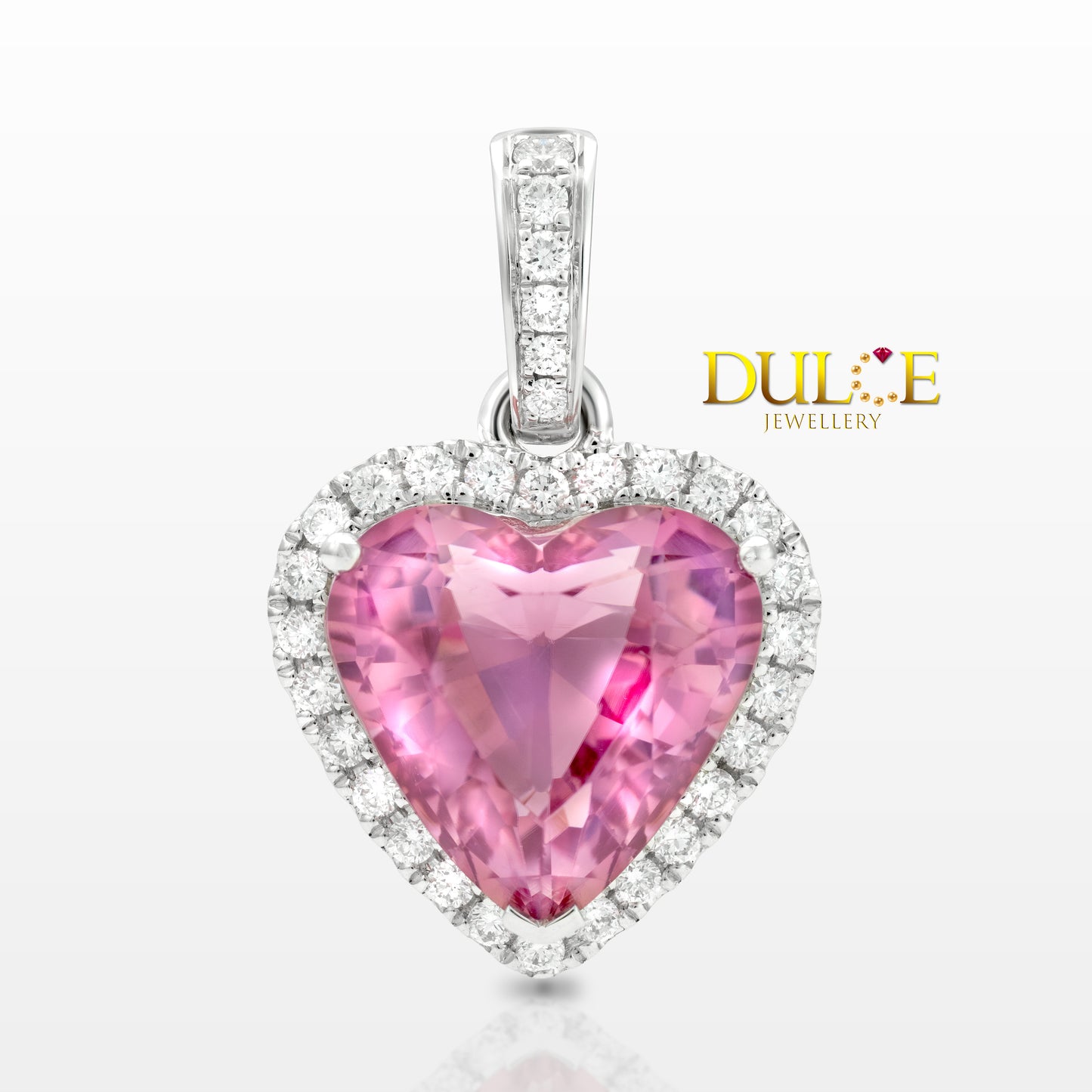 Heart-shaped pink gemstone pendant with diamonds on a white background, branded as Dulce Jewellery.