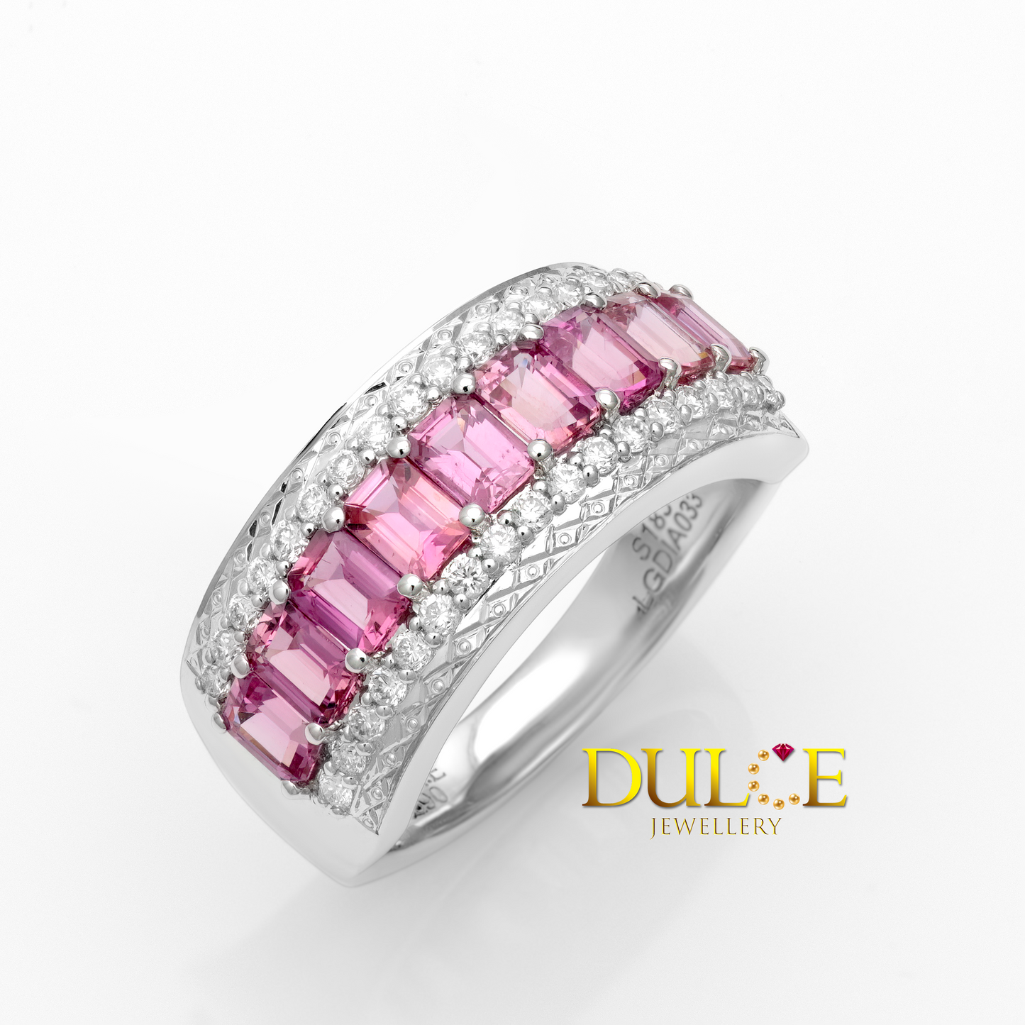 Gold ring with pink sapphire and diamonds, branded 'Dulce Jewellery'.