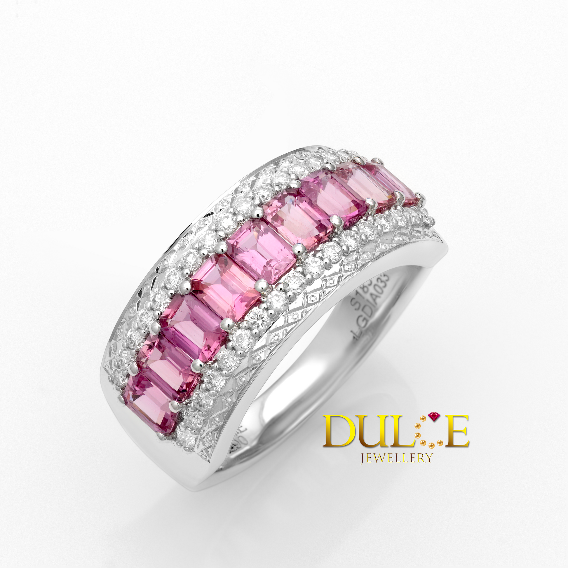 Gold ring with pink sapphire and diamonds, branded 'Dulce Jewellery'.