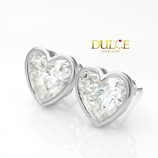 Heart-shaped diamond earrings with 'Dulce Jewellery' logo on a white background