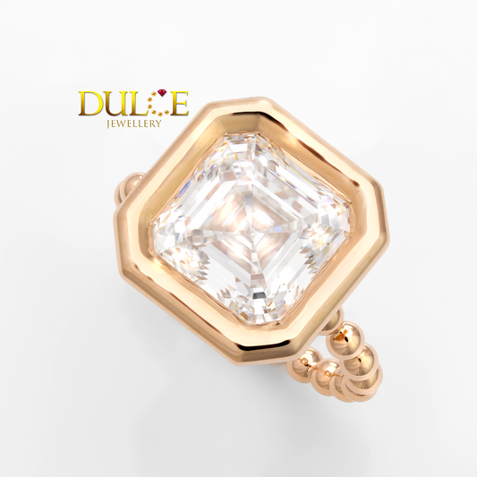 Gold ring with a large diamond on a white background, featuring the brand 'Dulce Jewellery'.