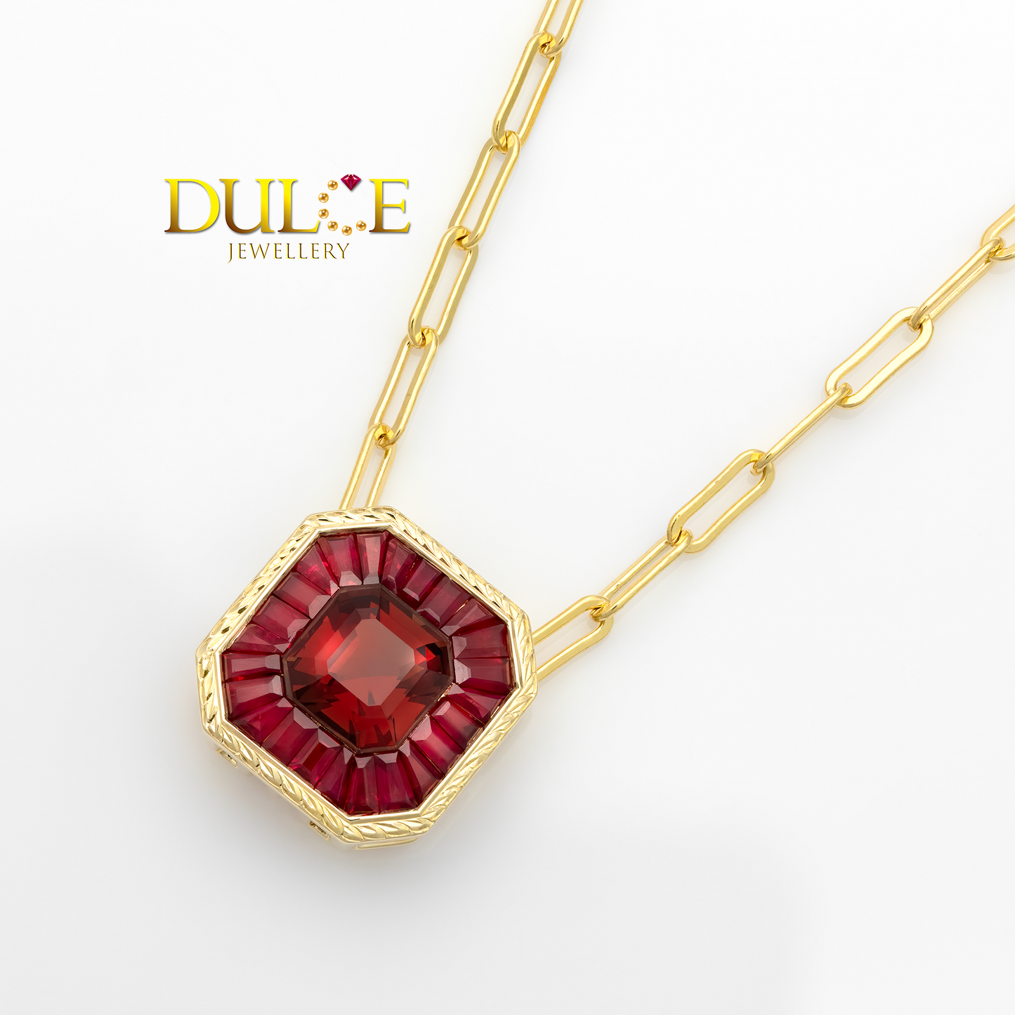 Gold necklace with a red spinel & ruby gemstone pendant on a white background, featuring the brand 'Dulce Jewellery'.