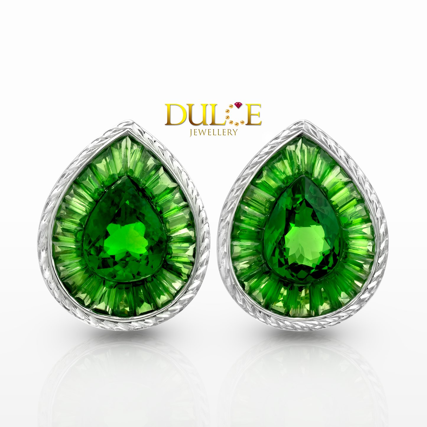 Pair of green teardrop earrings with gold setting on a white background, branded 'Dulie Jewellery'.