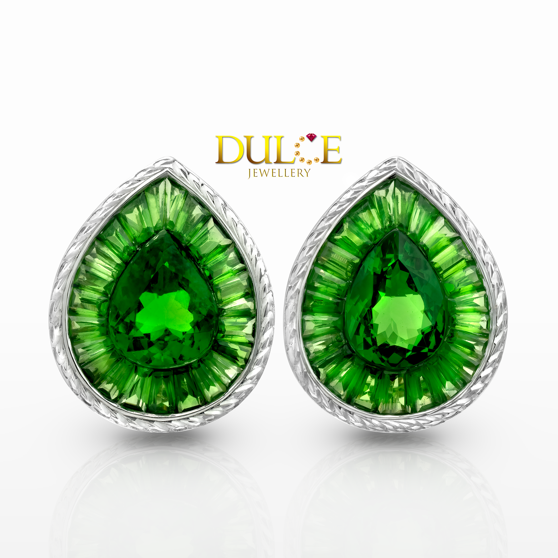 Pair of green teardrop earrings with gold setting on a white background, branded 'Dulie Jewellery'.