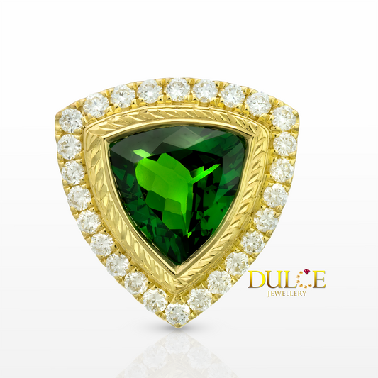 Gold ring with a green gemstone and diamonds, branded 'Dulce Jewellery'.