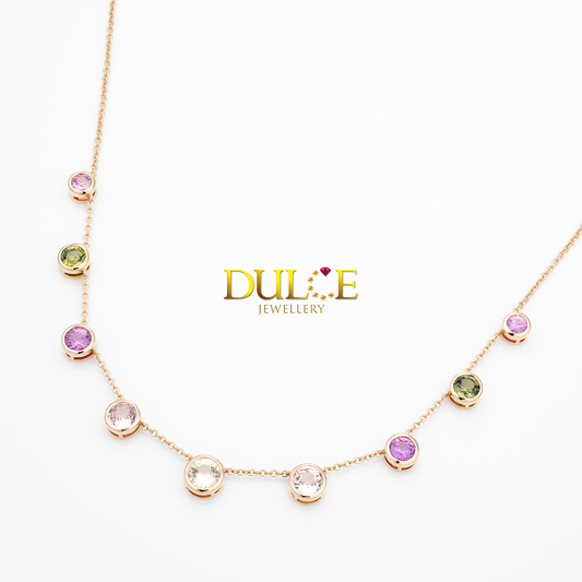 Necklace with multicolored gemstones on a white background, featuring the Dulcie Jewellery brand.