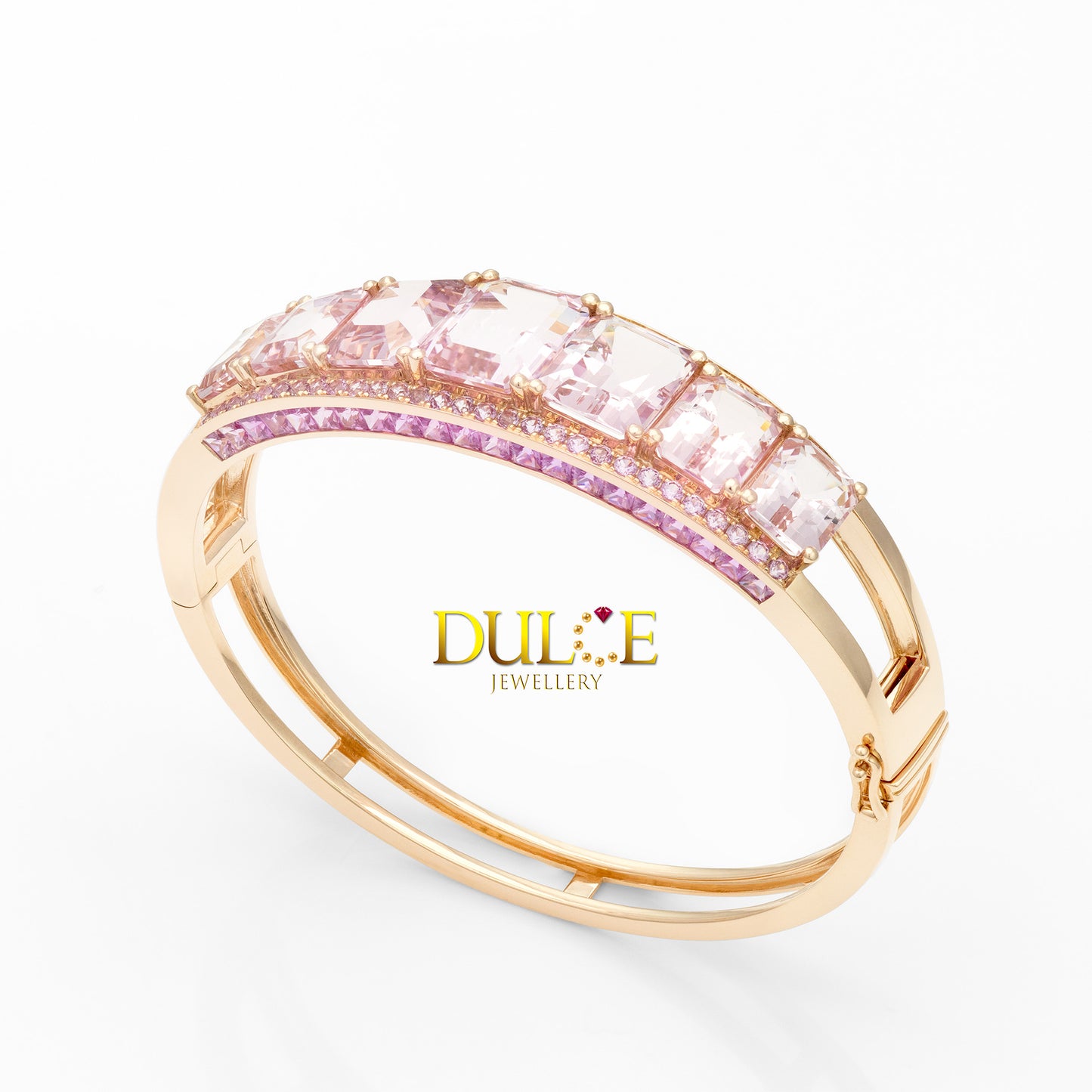 Gold ring with pink gemstones on a white background, featuring the Dulie Jewellery logo.