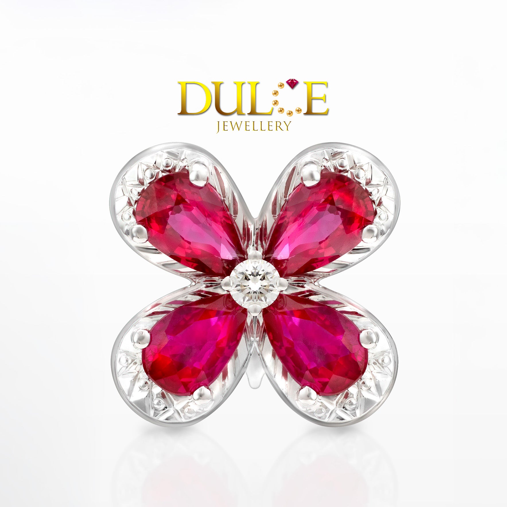 Floral jewelry piece with red gemstones and gold accents, branded as Dulce Jewellery.