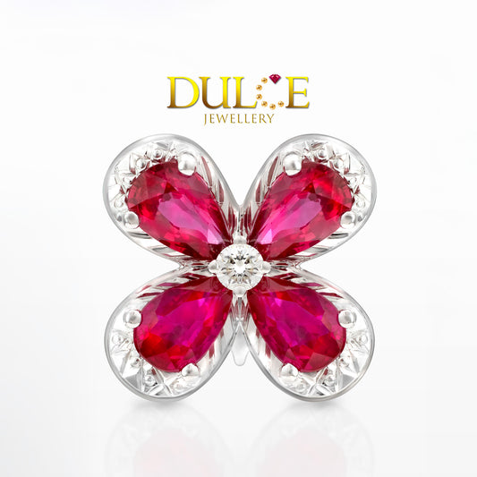 Floral jewelry piece with red gemstones and gold accents, branded as Dulce Jewellery.