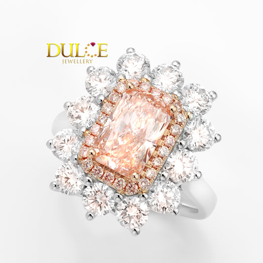 Dulce Jewellery ring with a pink gemstone and diamond accents on a white background
